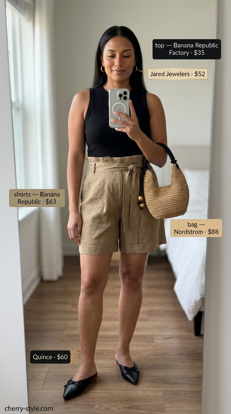 Khaki paperbag waist shorts for easy comfy summer outfits 2026. Chic evening look with knit tank and straw bag.