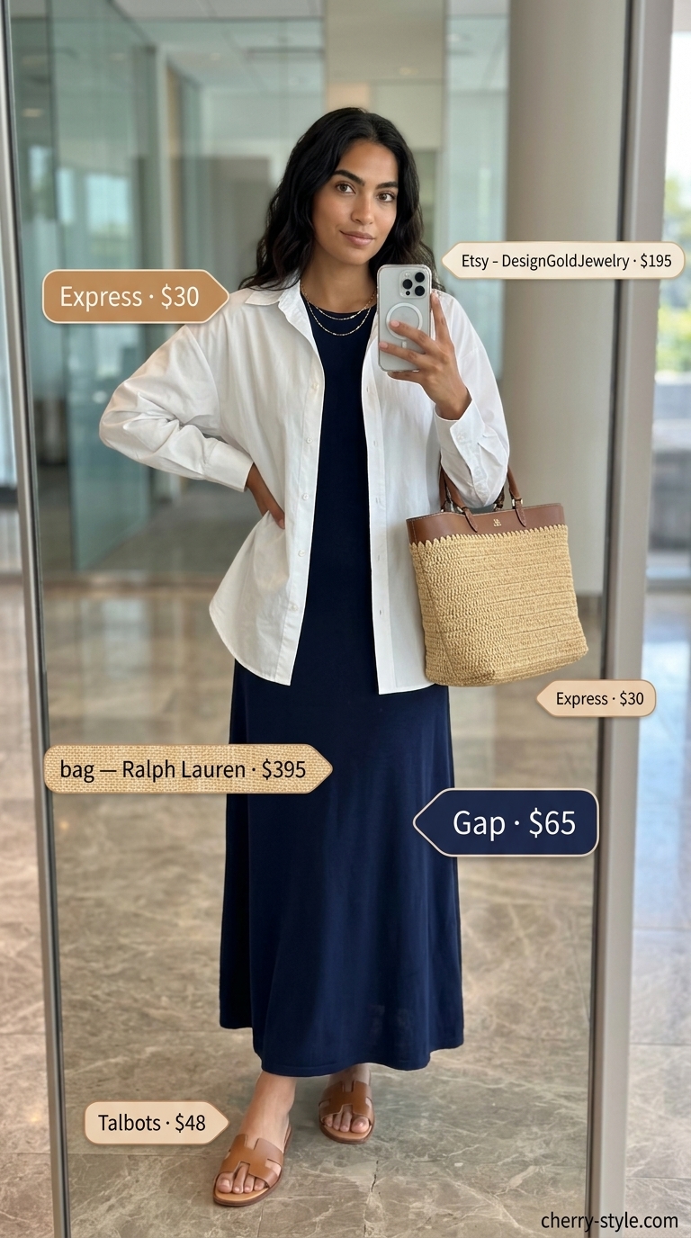 Smart summer work outfits for women 2026: Navy column maxi dress with white oversized shirt as jacket.