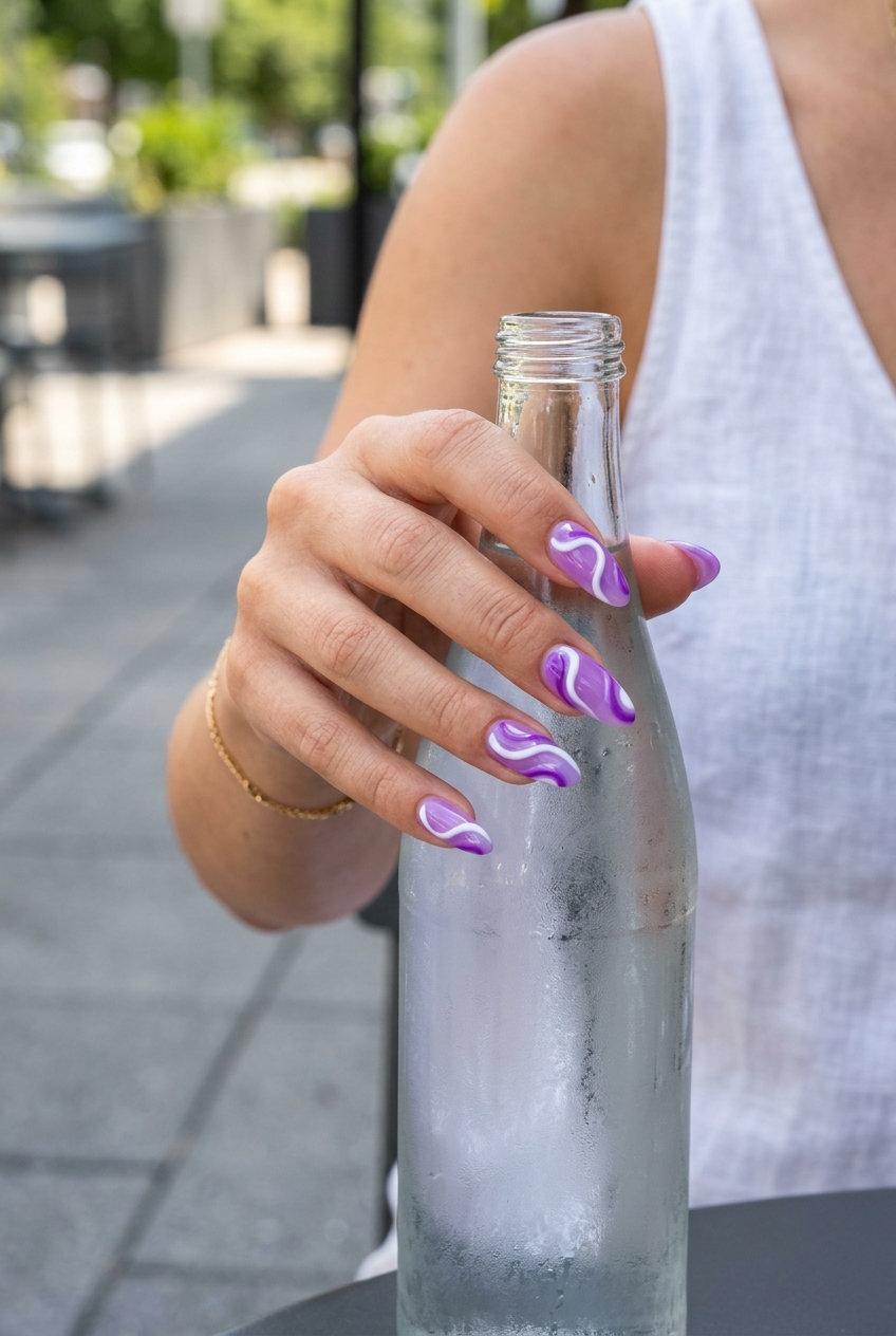 Almond Summer Nails 2026: Lavender Jelly Abstract Swirls Almond summer nails 2026 for fair skin: Playful lavender jelly with bold white & purple abstract swirls for festivals.