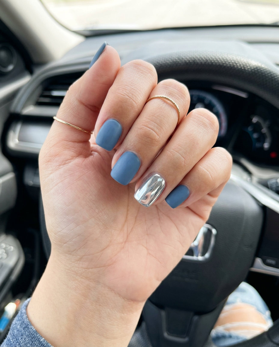 Denim blue matte nails with silver chrome accent for blue summer nails 2026. Sophisticated, modern, casual.