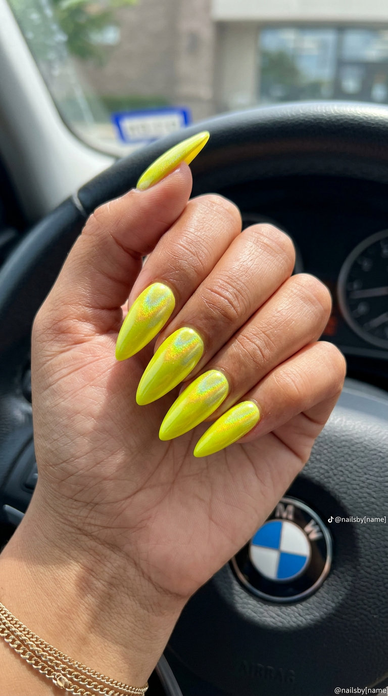 Cute summer nails 2026: Electric neon yellow with holographic chrome shift on stiletto nails.