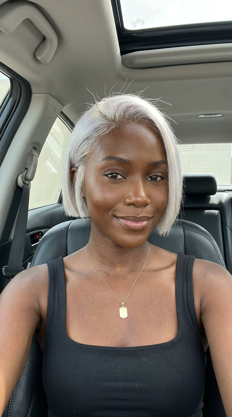 short crop haircut with icy platinum blonde, blunt perimeter, no bangs — futuristic summer