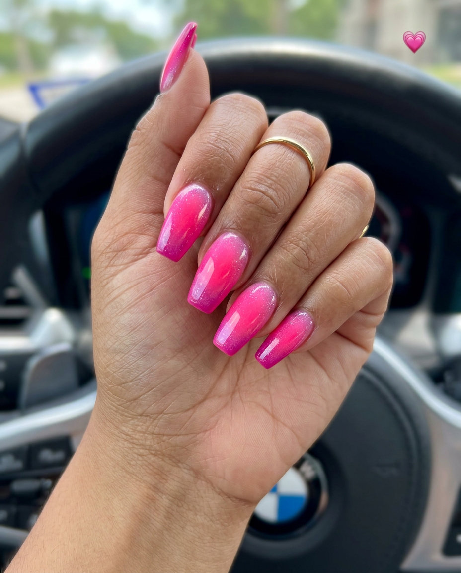 Vibrant fuchsia to hot pink gradient nails with iridescent shimmer. June manicure ideas - summer trends 2026.