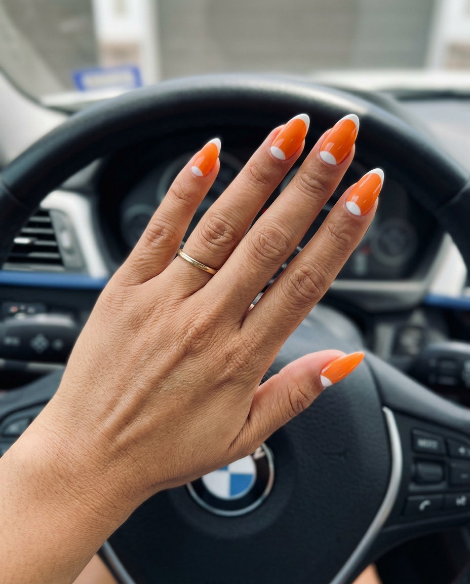 Vibrant coral reverse French nails for vacation & summer parties. Energetic sultry nail ideas 2026.