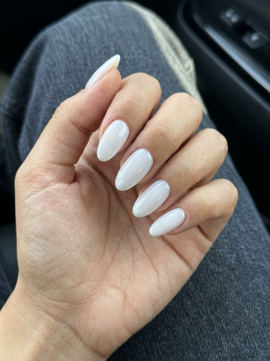 Sophisticated Oval Nails 2026: Sculpted Milky White Sculpted Milky White Oval nails: opaque milky white with cool undertones for oval summer nails 2026.