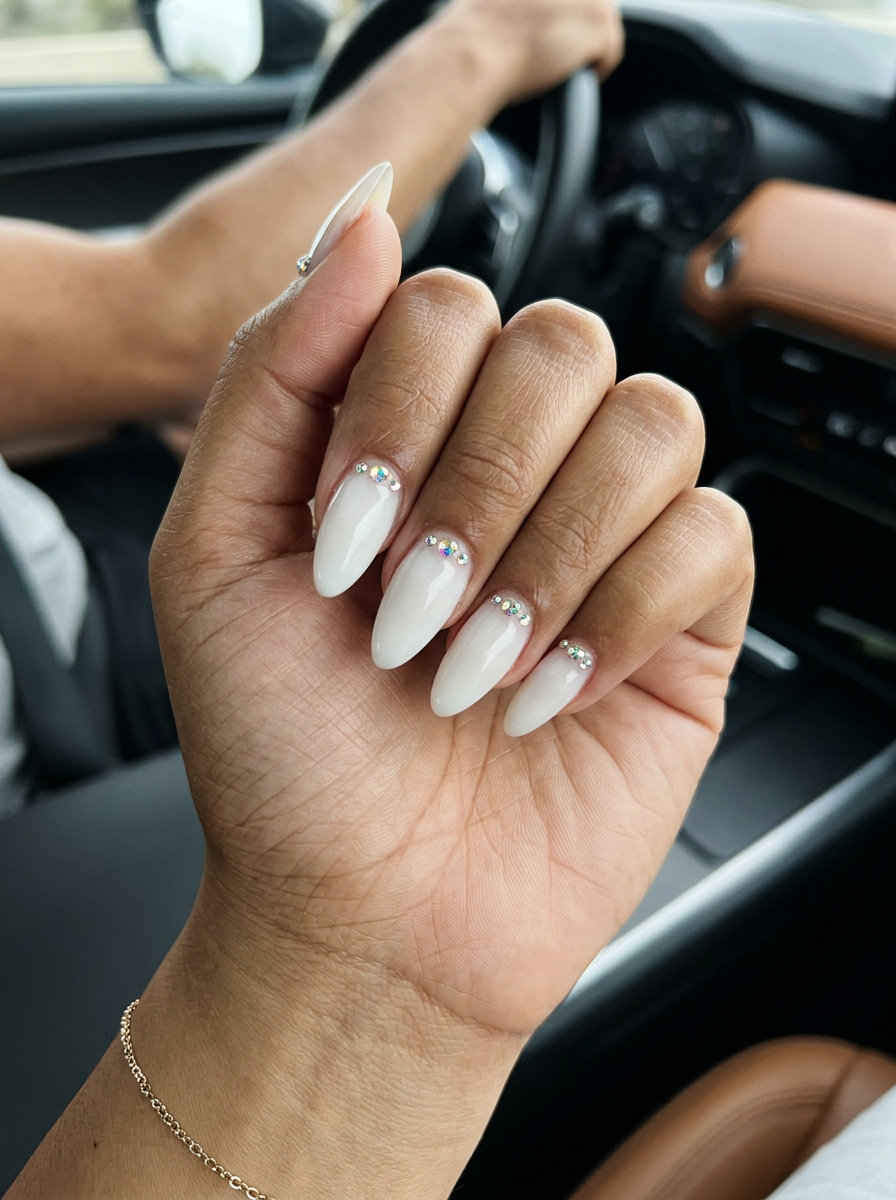 Glamorous milky white nails with iridescent jewel accents for shell summer nails 2026.