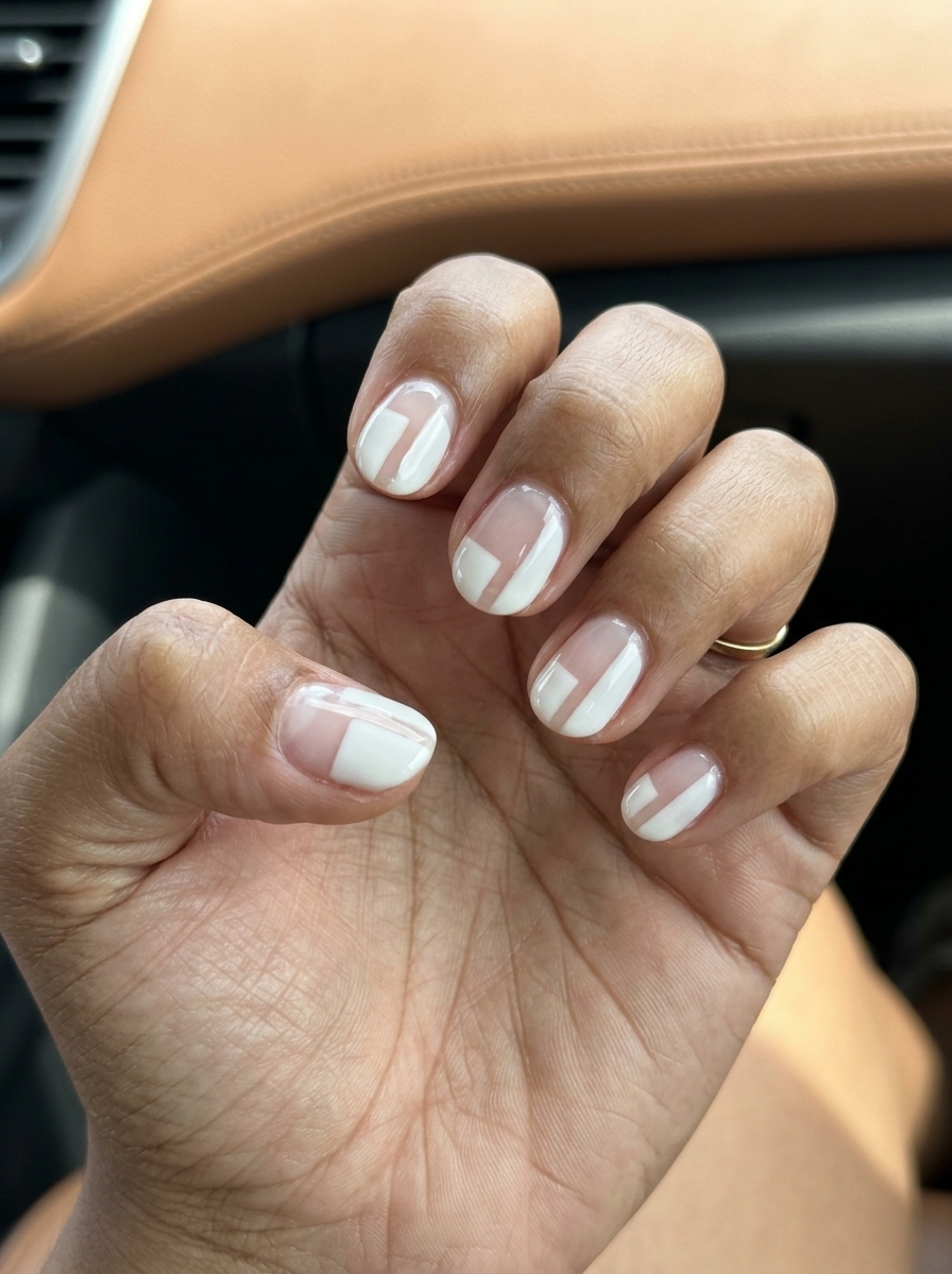 Simple short summer nails 2026: Milky white round negative space for modern events. Chic & understated.