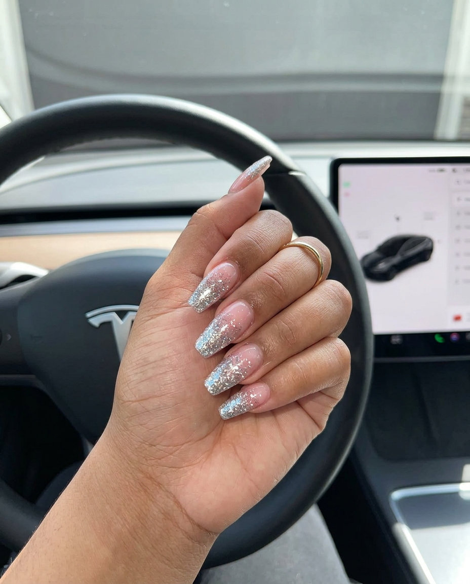 Disco Ball Glitter Coffin nails: Silver glitter ombre on clear/nude base for party, concert, night out. Summer glitter nails 2026.