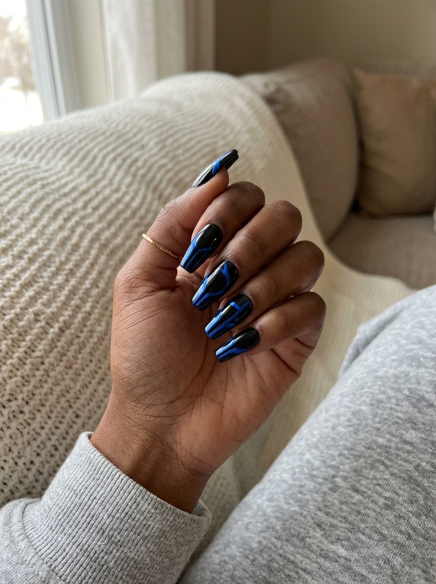 Cobalt chrome abstract lines on black nails for summer nails for dark skin 2026. Edgy concert style.