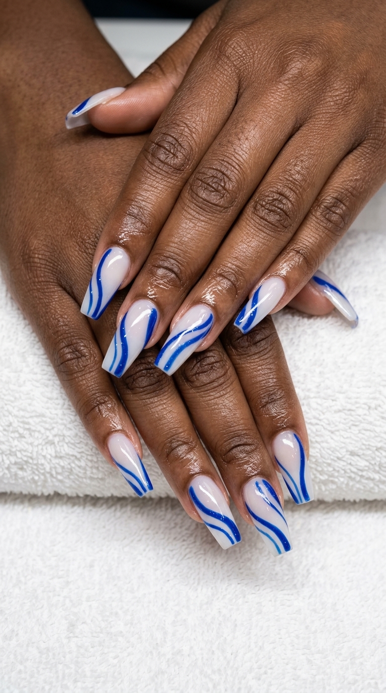Cobalt blue abstract line nails for summer nails for dark skin 2026. Edgy, artistic festival style.