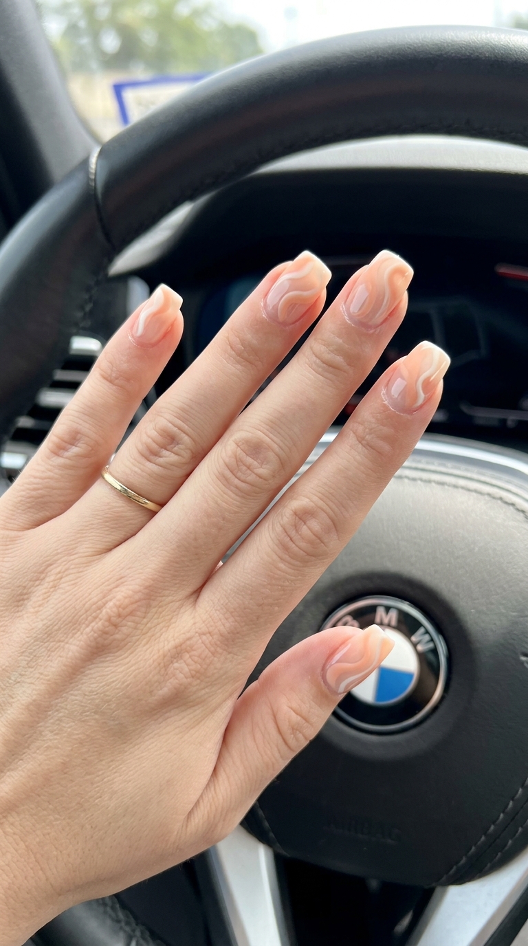 Peach Fuzz Swirl Nails 2026: Trendy Summer Art Abstract swirls in peach fuzz square nails for summer 2026. Playful artistic trendy look.