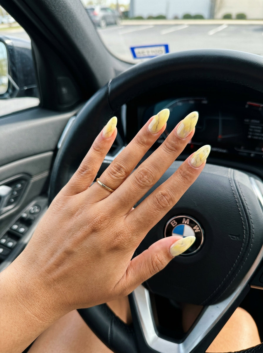 Citrus Cloud Marble nails for summer 2026. Milky white with yellow and grey swirls for a sophisticated look.