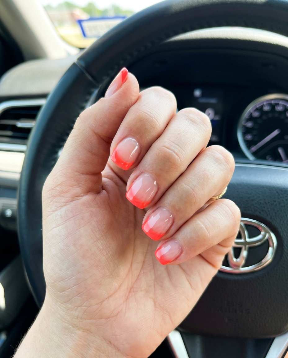 Vivid coral reverse French nails for summer vibes nails 2026. Trendy for date night and summer parties.