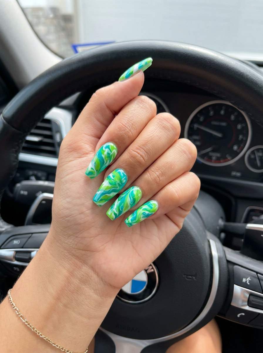 Adventurous tropical nail designs 2026: Exotic jungle marble with vivid turquoise, lime green, and white on coffin nails.