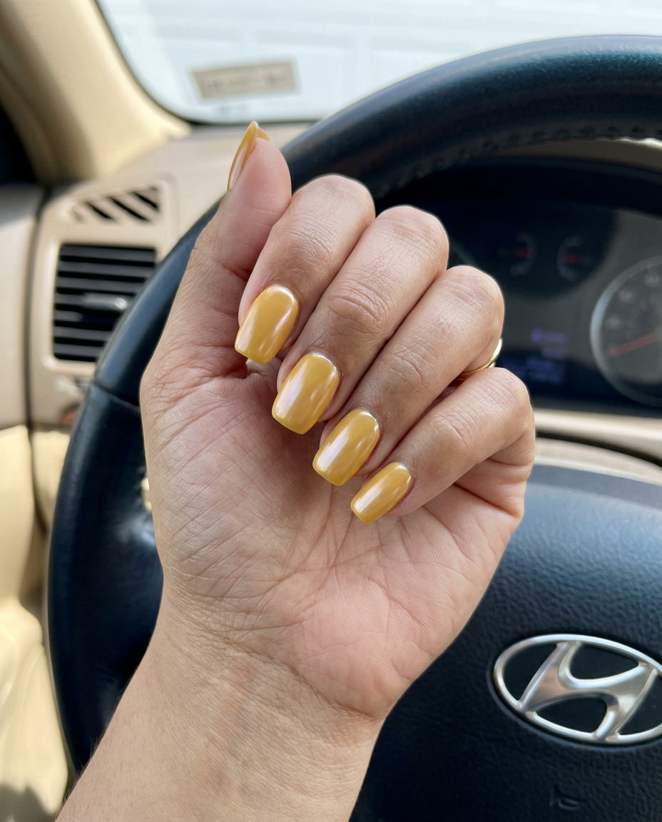 Chic mustard yellow glazed donut nails for casual outings. Yellow summer nails 2026.